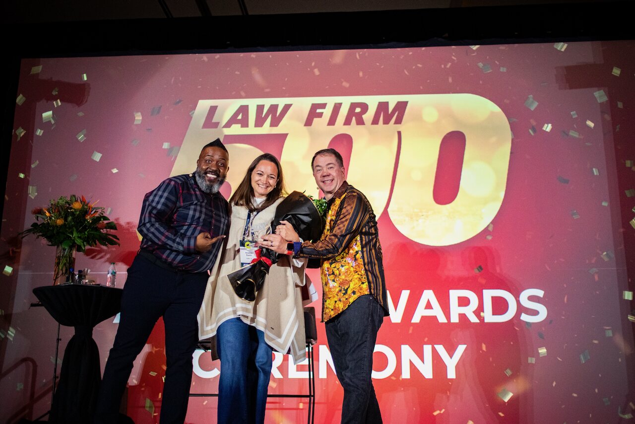 Just Well Law celebrating its number one Law Firm 500 ranking on stage at the 2026 awards ceremony